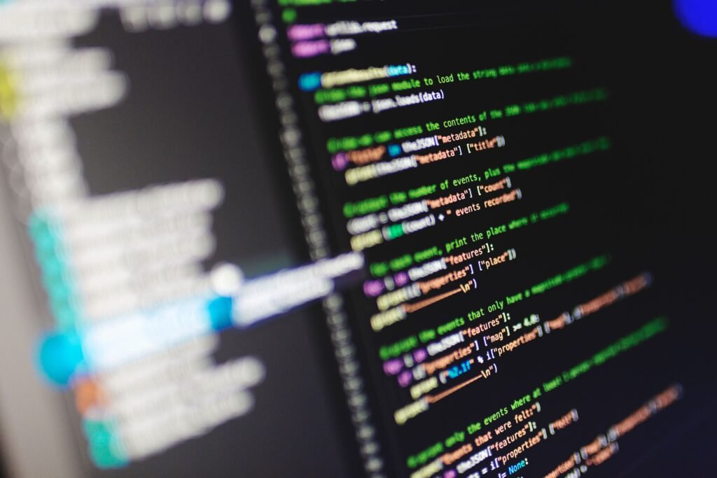 How to Start Learning Programming as a Beginner Close-up of a computer screen displaying colorful programming code in JavaScript.
